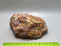 a mostly red jasper with amix of other colors in irregular patterns.